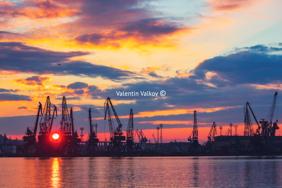 "Sea port and industrial cranes, Varna, Bulgaria.Sunset over the" stock image