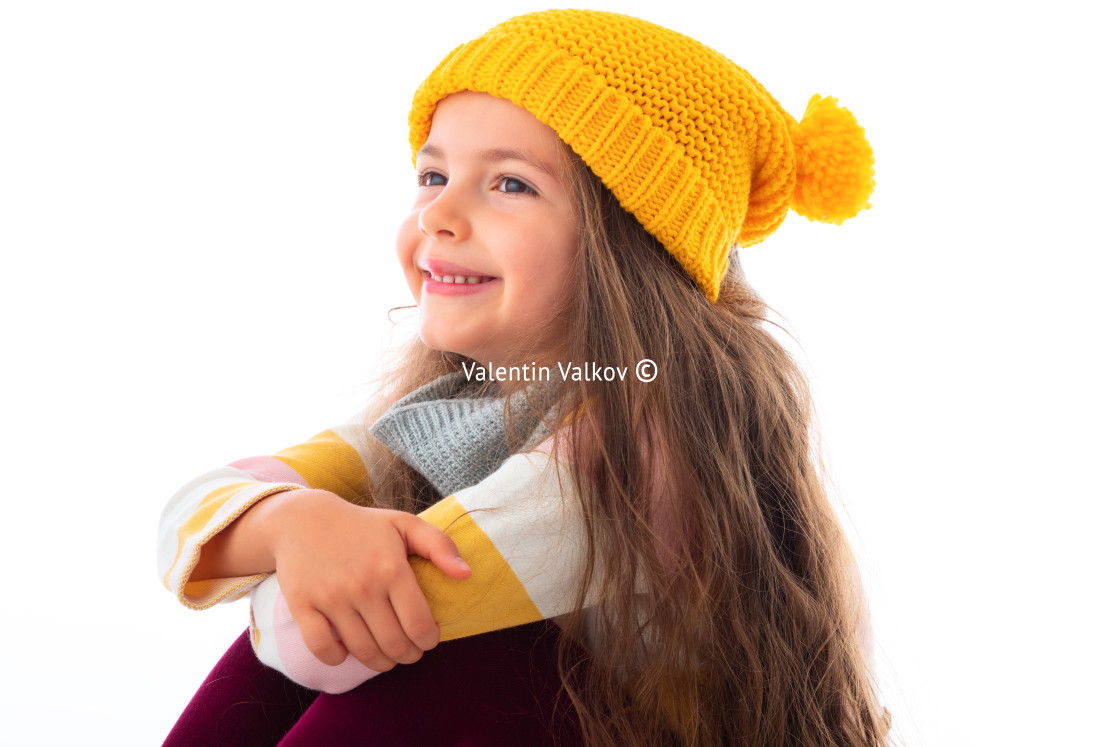 "Happy beautiful young girl with colourful clothes posing in stud" stock image