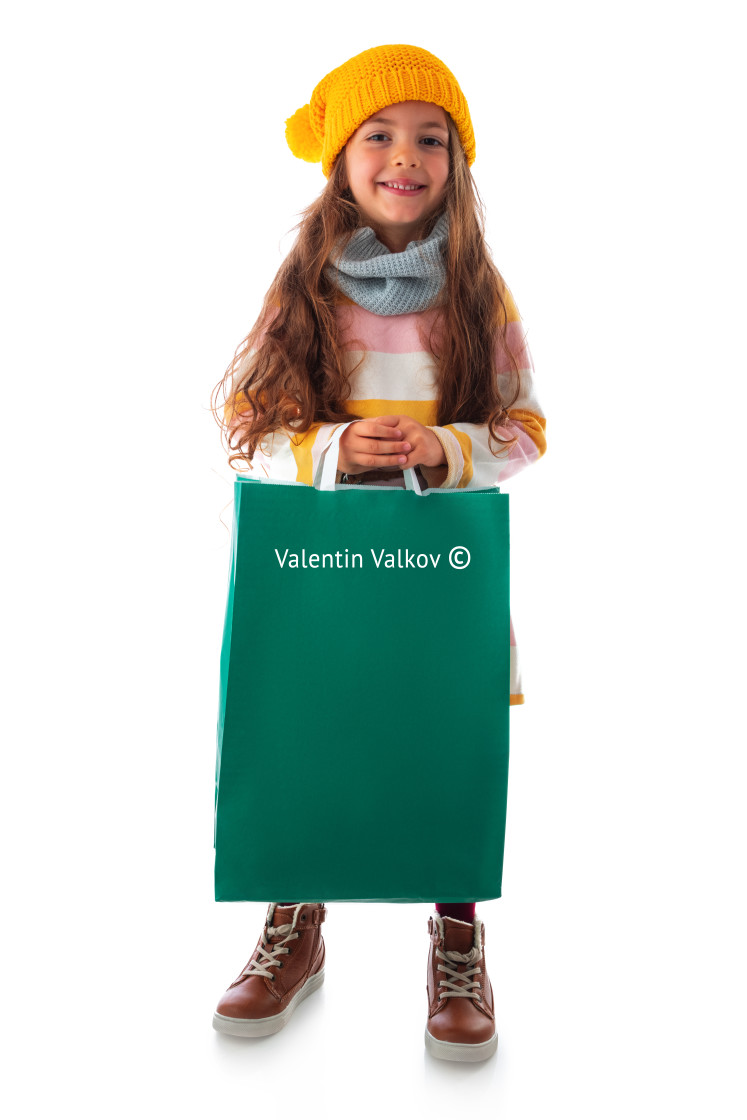 "Happy beautiful young girl with shopping bag, portrait on white" stock image