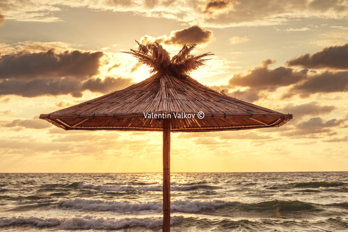 "Straw umbrella on tropical sea beach" stock image