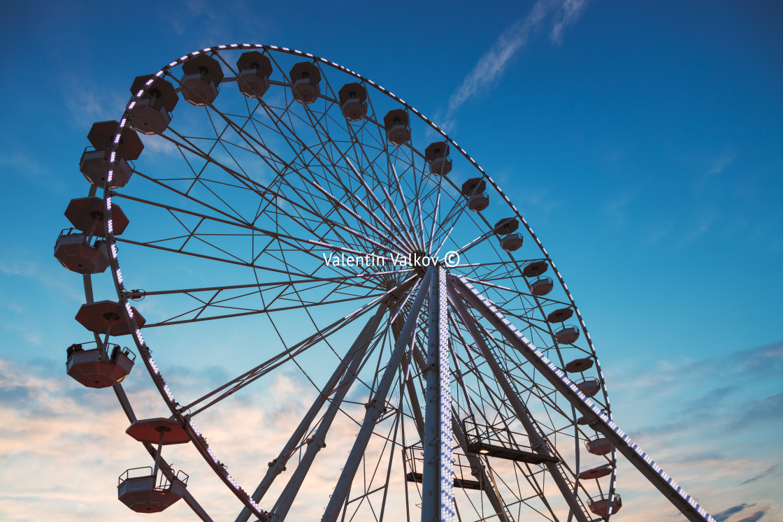 "Ferris Wheel with sunset sky and clouds" stock image