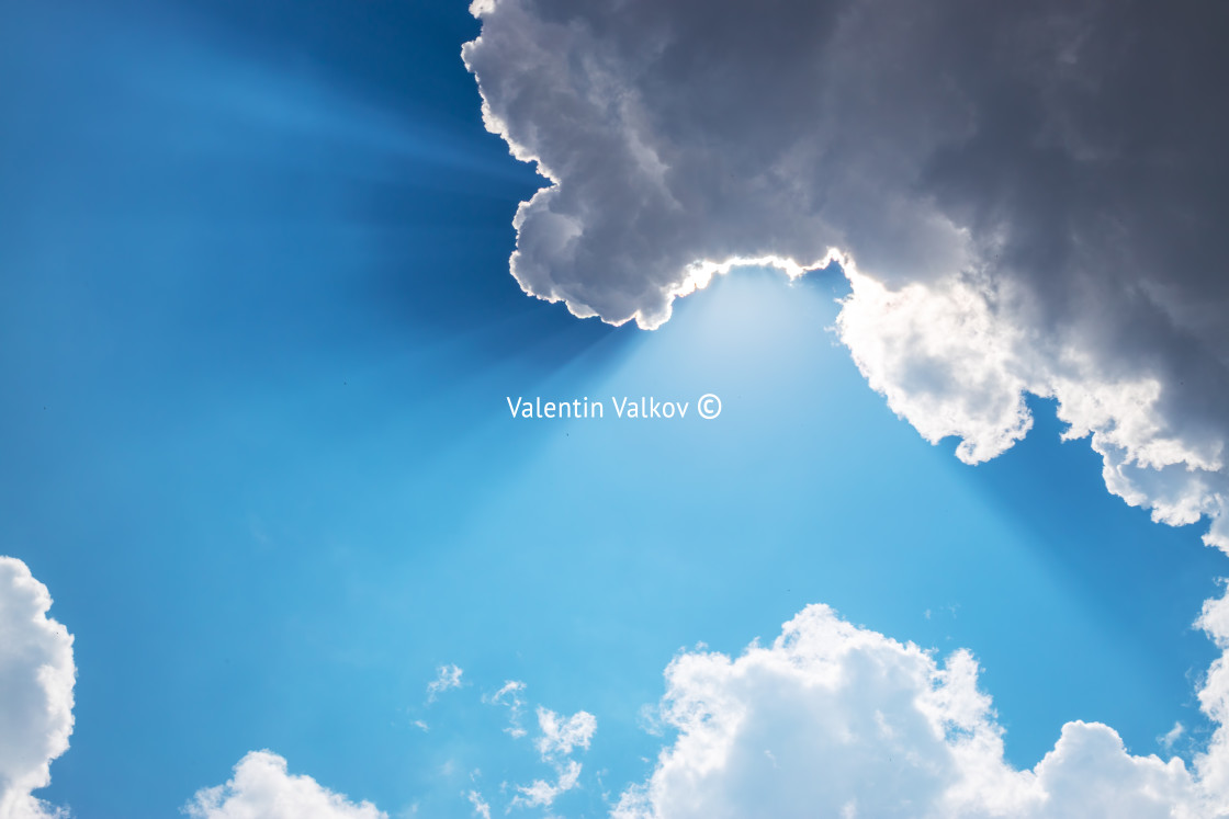 "Sun, sunbeam and clouds in blue sky" stock image