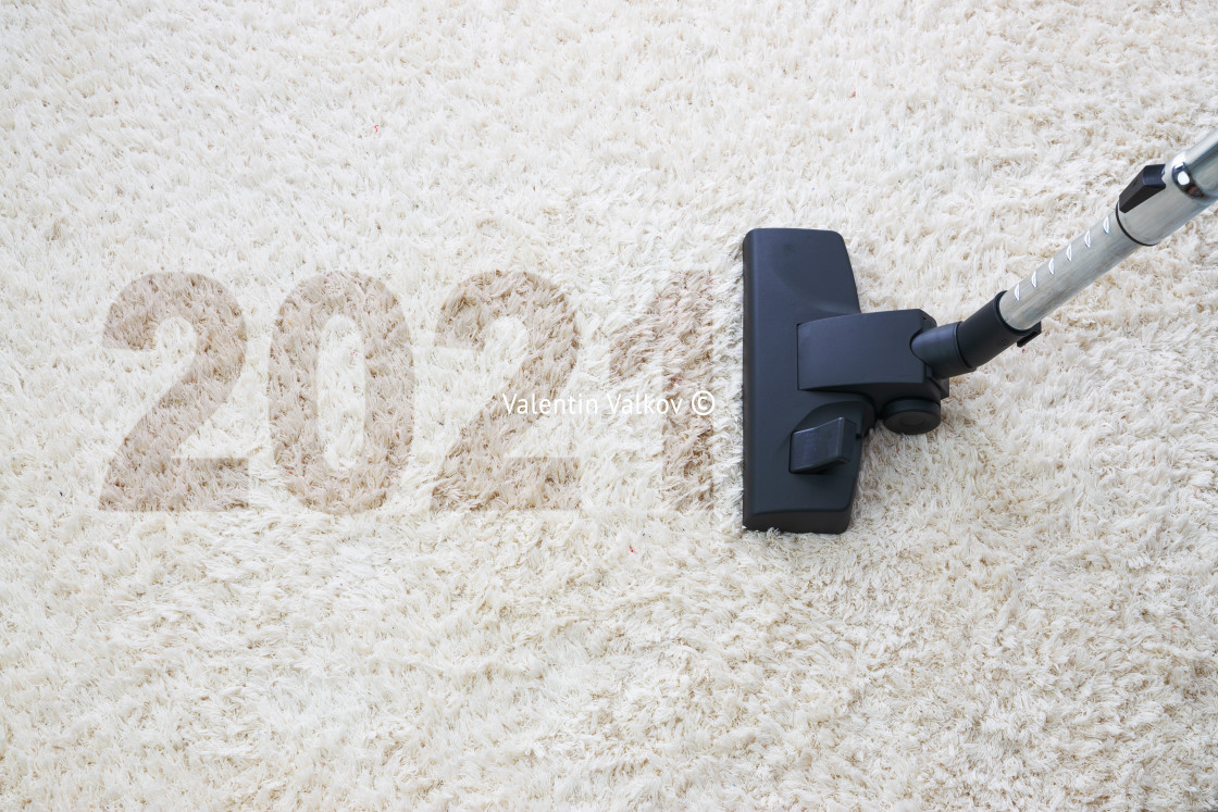 "2021 New year home cleaning with vacuum cleaner and copy space f" stock image