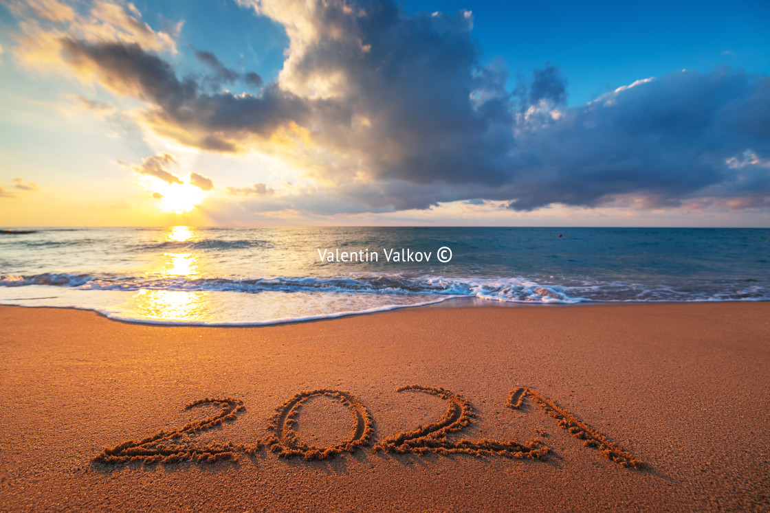 "Happy New Year 2021 concept, lettering on the beach. Written tex" stock image