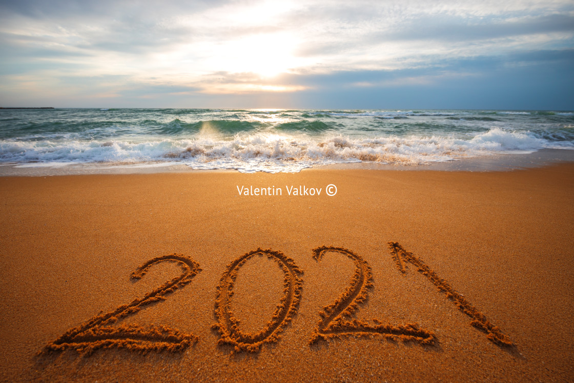 "Happy New Year 2021 concept, lettering on the beach. Written tex" stock image