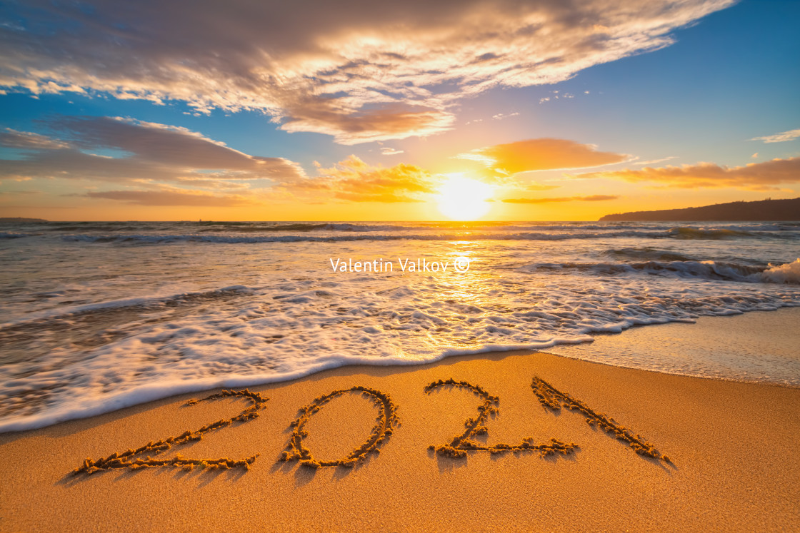 "Happy New Year 2021 concept, lettering on the beach. Written tex" stock image