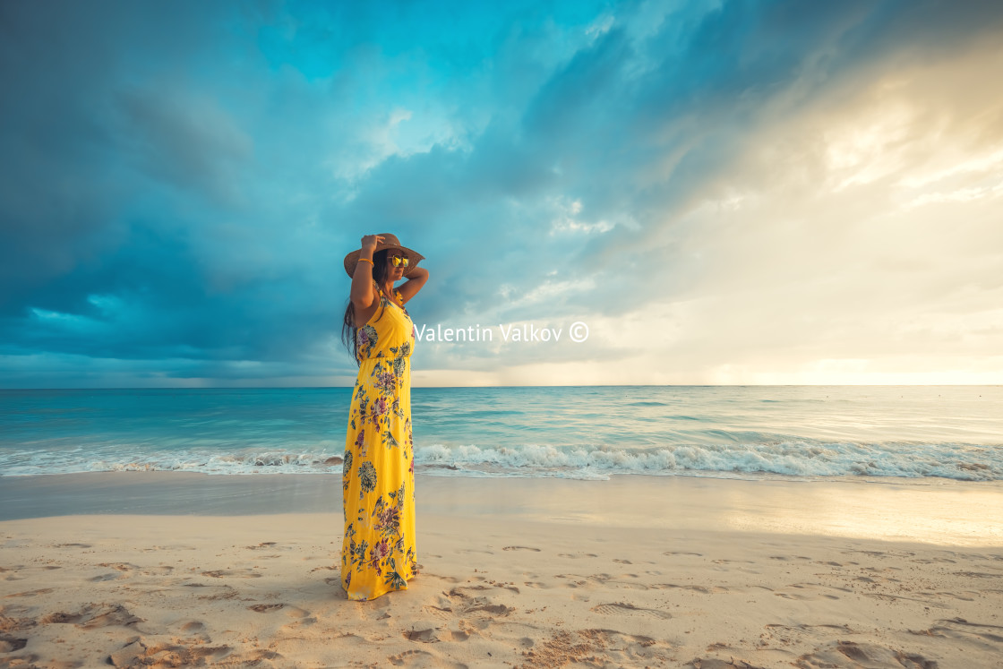 "Carefree young woman relaxing on tropical beach" stock image