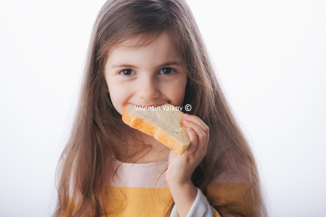 "Little girl hold slice of homemade healthy bread" stock image