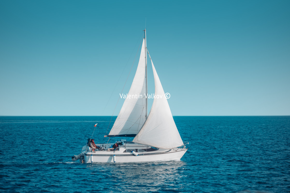 "Regatta sailing ship yachts with white sails at opened sea" stock image