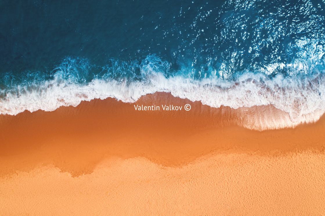 "Aerial top view from drone of sandy beach with turquoise sea wav" stock image