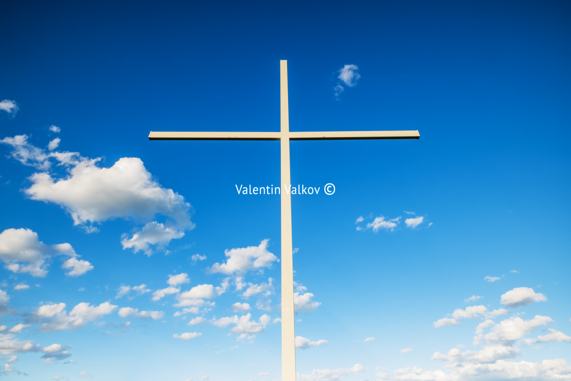 "Christian cross against clouds" stock image