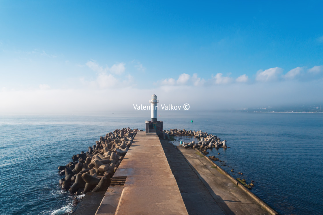 "Aerial view of lighthouse at foggy sunrise in Varna, Bulgaria" stock image