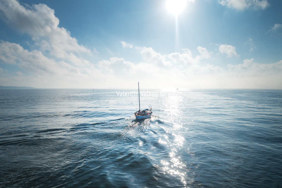 "Aerial view of sailing ship in sea, foggy sunrise" stock image