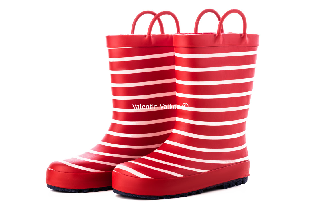 "Red striped kids rubber boots for rain isolated on white backgro" stock image