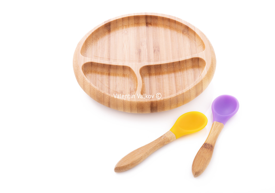 "Wooden bowl. Bamboo plate with spoon isolated on white backgroun" stock image