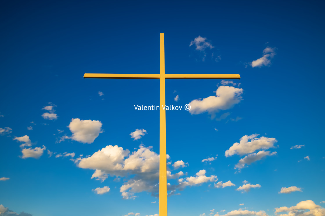 "Christian cross against clouds" stock image