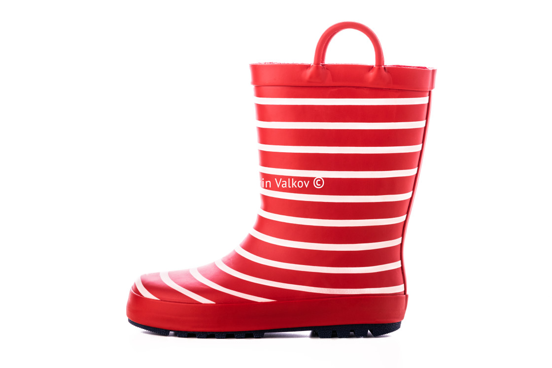 "Red striped kids rubber boots for rain isolated on white backgro" stock image