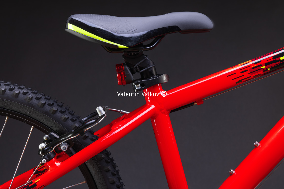 "Sport mountain red bicycle isolated on black background" stock image