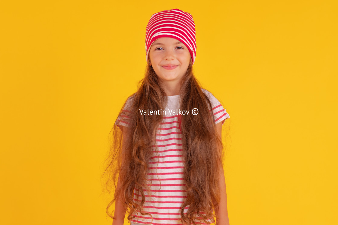 "Happy emotional girl smiling on colored yellow background. Autum" stock image