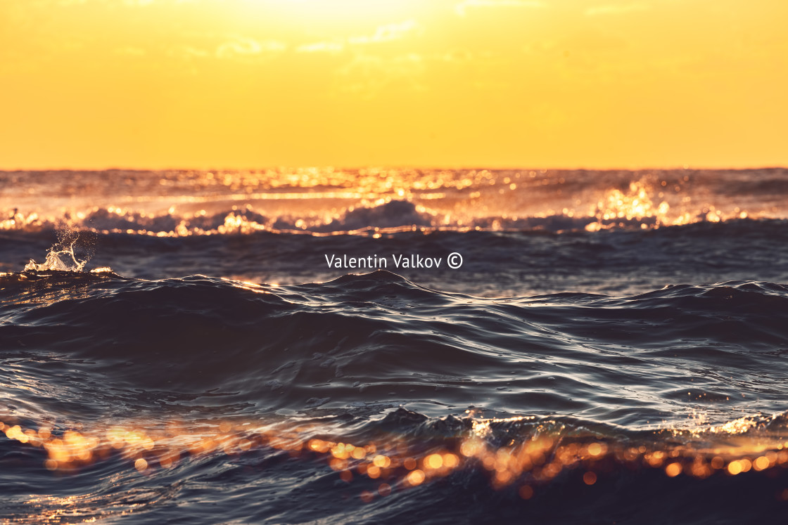 "Golden splashing waves and sunrise sea" stock image