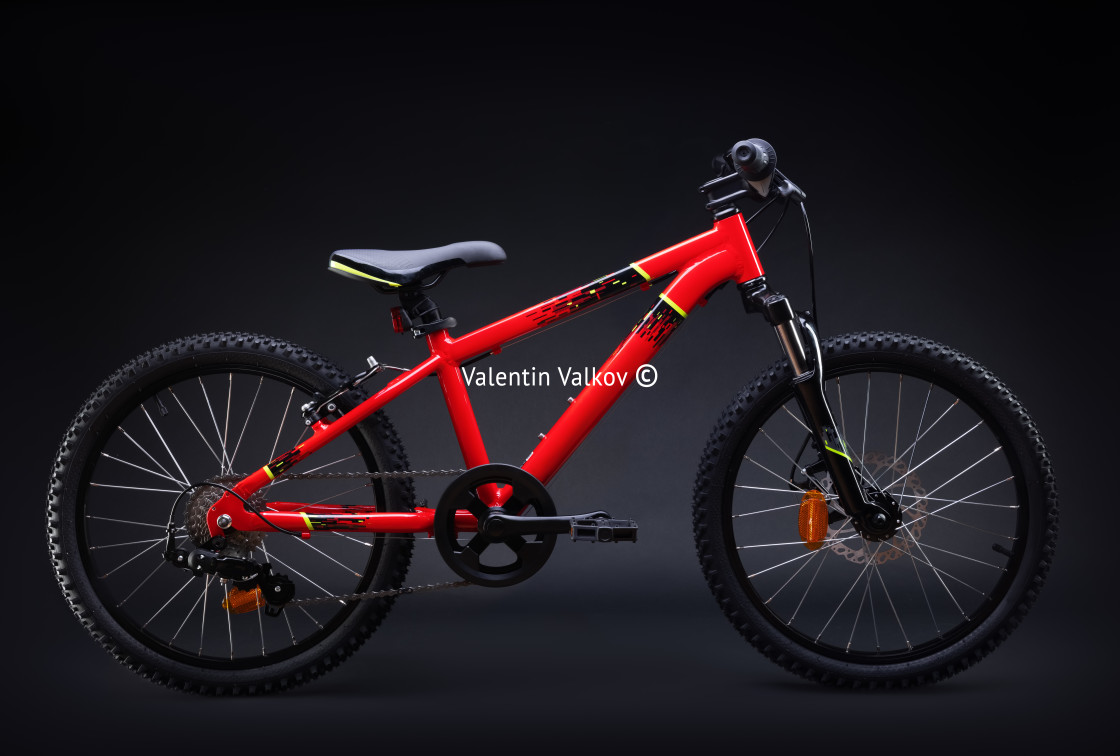 "Sport mountain red bicycle isolated on black background" stock image