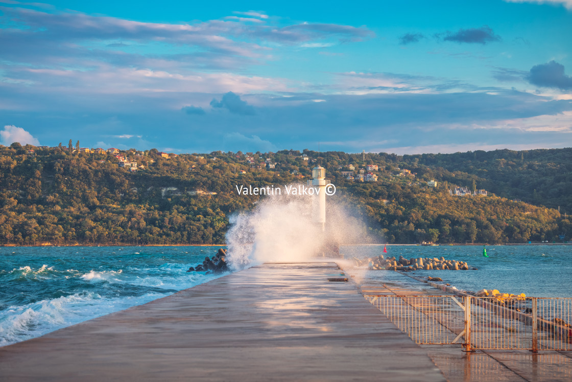 "Lighthouse and splashing wave in Varna, Bulgaria" stock image