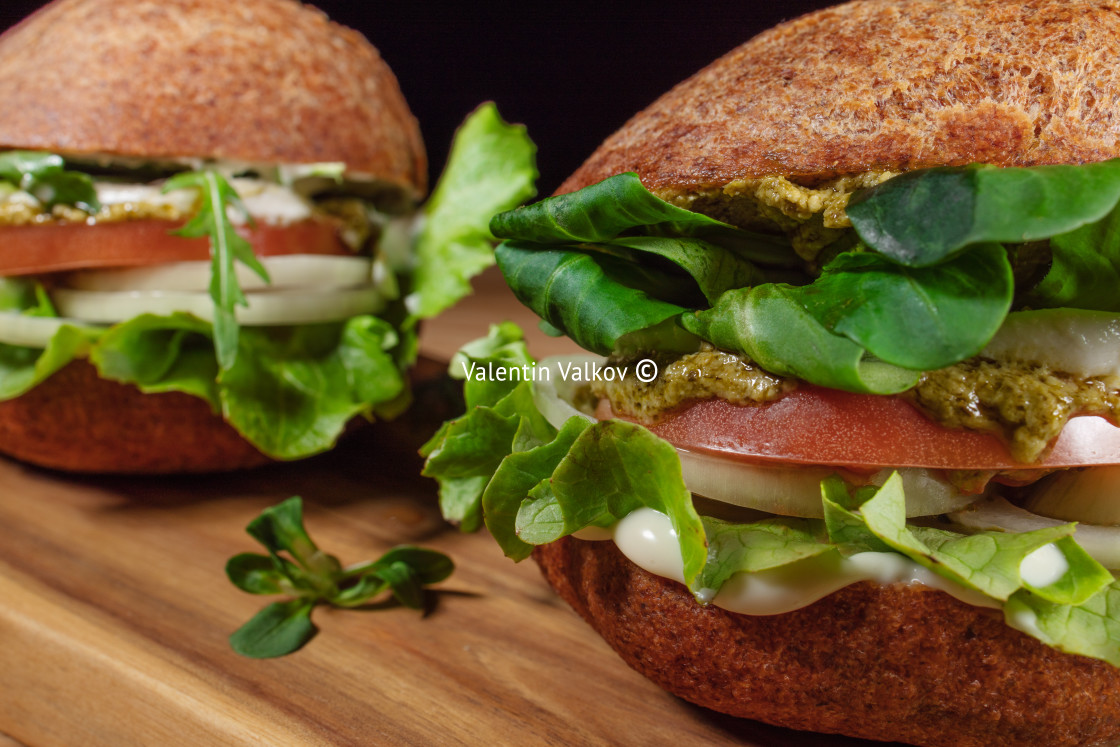 "Healthy Vegan Burger. Hamburgers on a wooden table." stock image