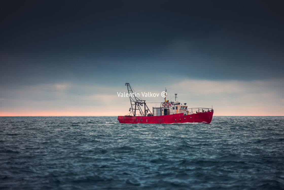 "Sailing cargo ship and waves at sunrise. Transportation. Logisti" stock image