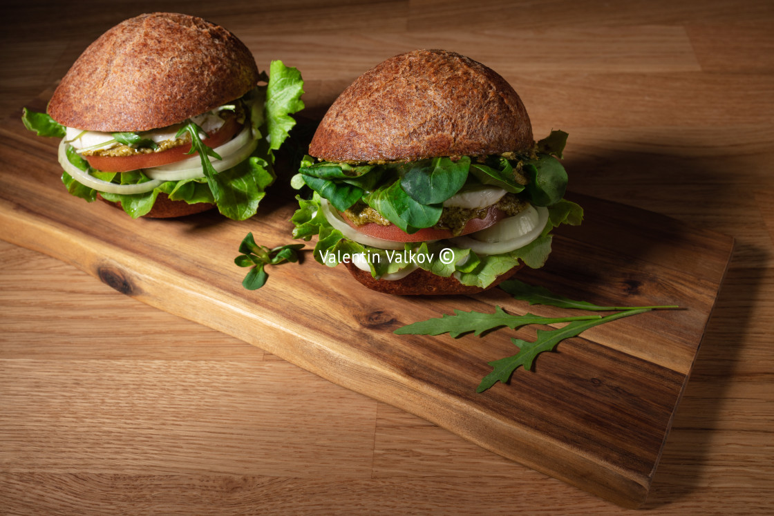 "Healthy Vegan Burger. Hamburgers on a wooden table." stock image