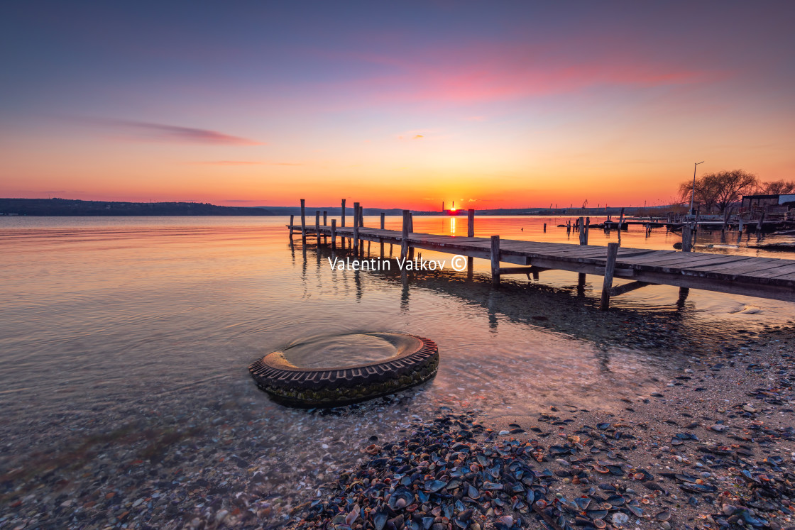 "Small Dock and the lake at sunset" stock image