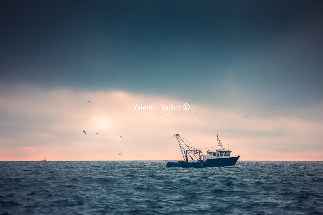 "Sailing cargo ship and waves at sunrise. Transportation. Logisti" stock image