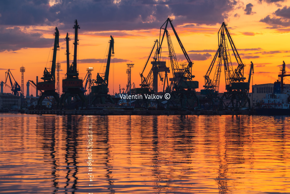 "Sunset over sea port and industrial cranes, Varna" by Valentin Valkov - £20.00 "Sunset over sea port and industrial cranes, Varna" stock image