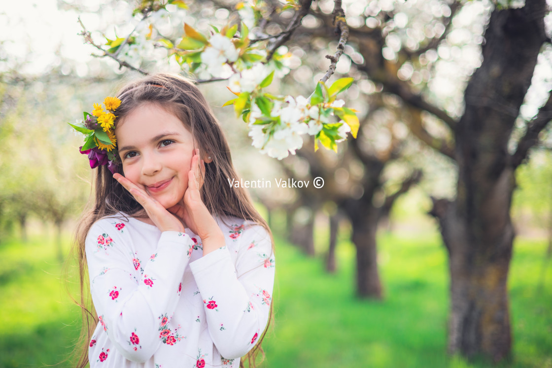 "Happy beautiful girl enjoying blooming spring trees in apple orc" by Valentin Valkov - $24.90 "Happy beautiful girl enjoying blooming spring trees in apple orc" stock image