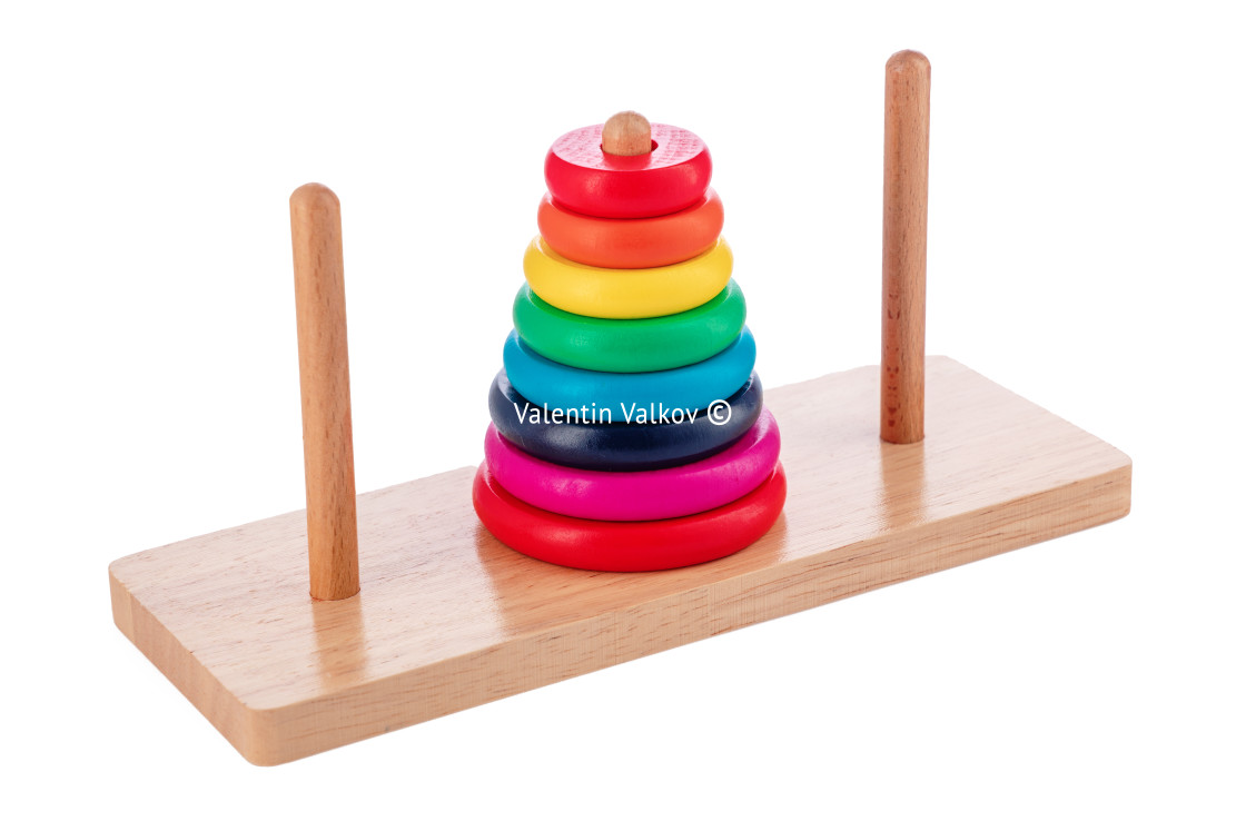 "Wooden puzzle tower of hanoi with color rings isolated on white" stock image