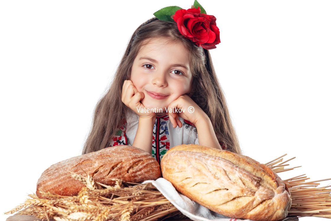 "Beautiful girl and fresh homemade baked bread. Woman in traditio" stock image