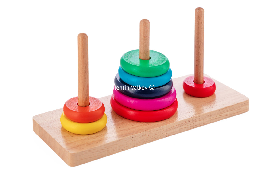 "Wooden puzzle tower of hanoi with color rings isolated on white" stock image