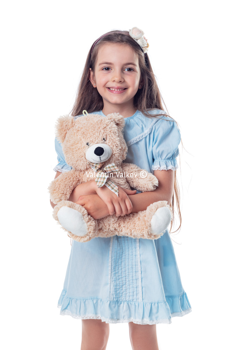 "Happy beautiful girl with his favorite toy fluffy friend teddy b" stock image