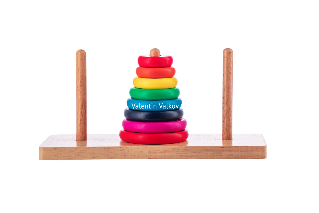 "Wooden puzzle tower of hanoi with color rings isolated on white" stock image