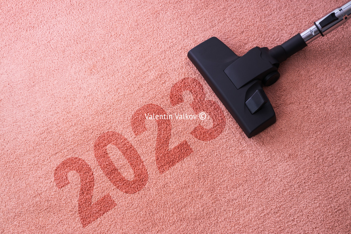 "2023 New year home cleaning with vacuum cleaner and copy space f" stock image