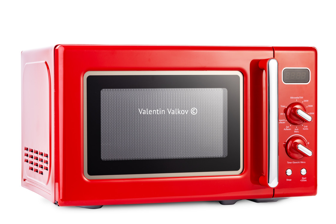 "Modern red microwave oven for cooking food isolated on white bac" stock image