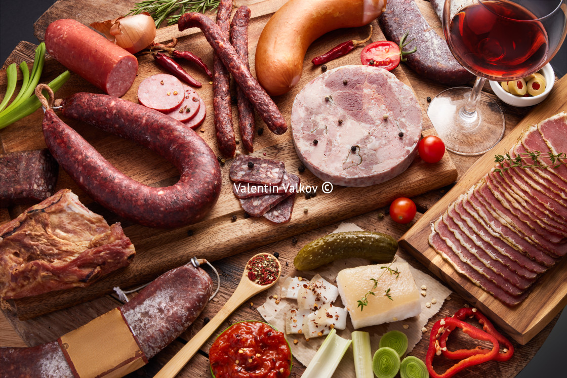 "Culinary food background of various smoked meats, salami sausage" stock image