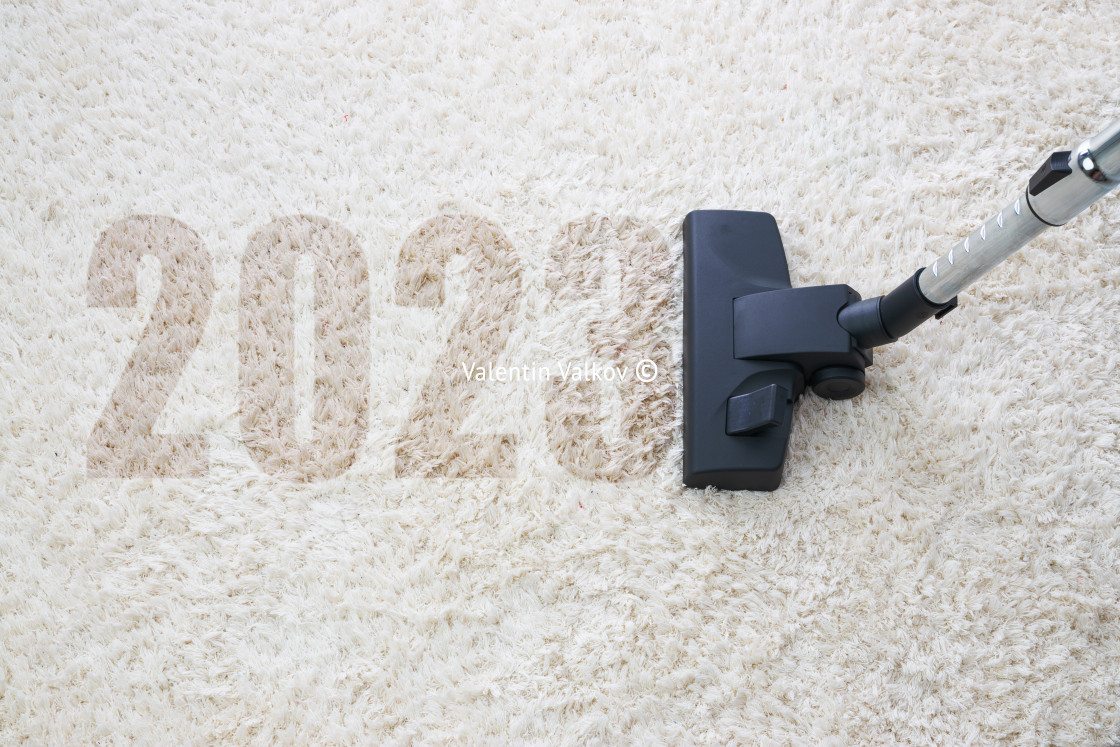 "2023 New year home cleaning with vacuum cleaner and copy space f" stock image