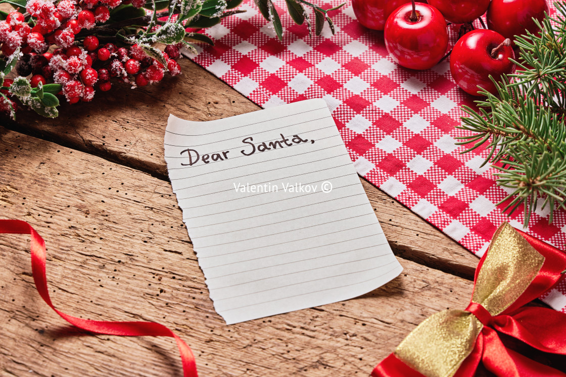 "Dear Santa Claus wish card and letter on wooden desk with many c" stock image