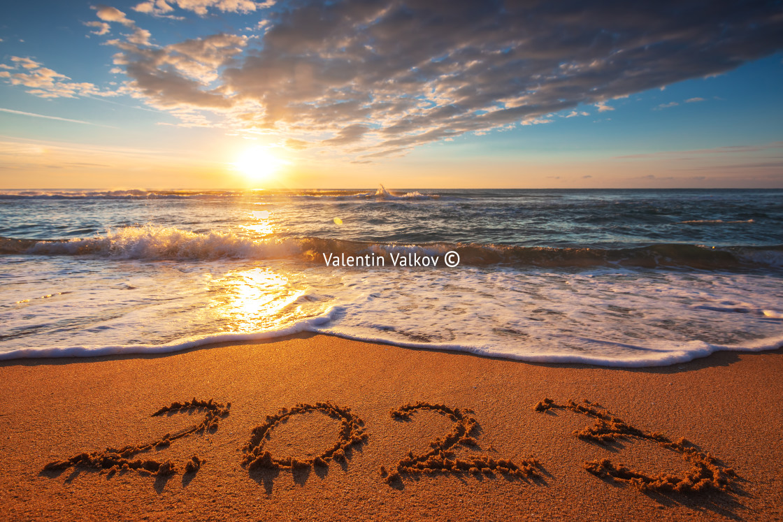 "Happy New Year 2023 concept, lettering on the beach. Written tex" stock image