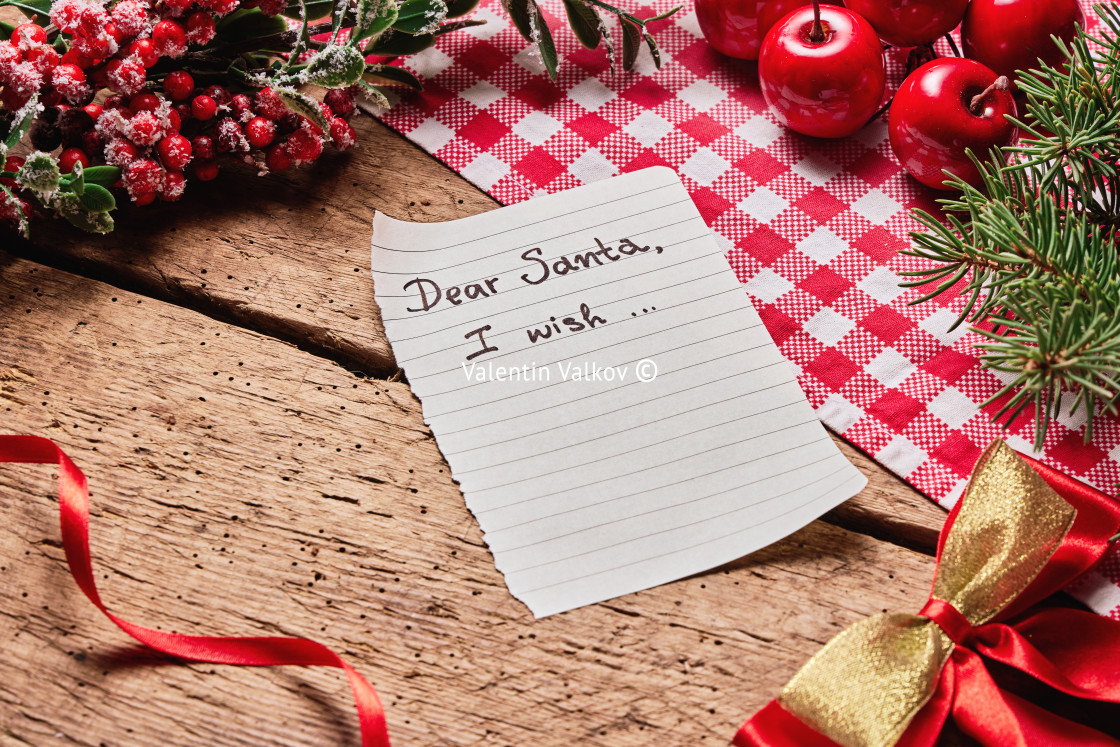 "Dear Santa Claus wish card and letter on wooden desk with many c" stock image