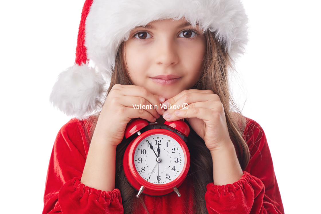 "Christmas woman with red alarm clock, smiling girl in red Santa" stock image