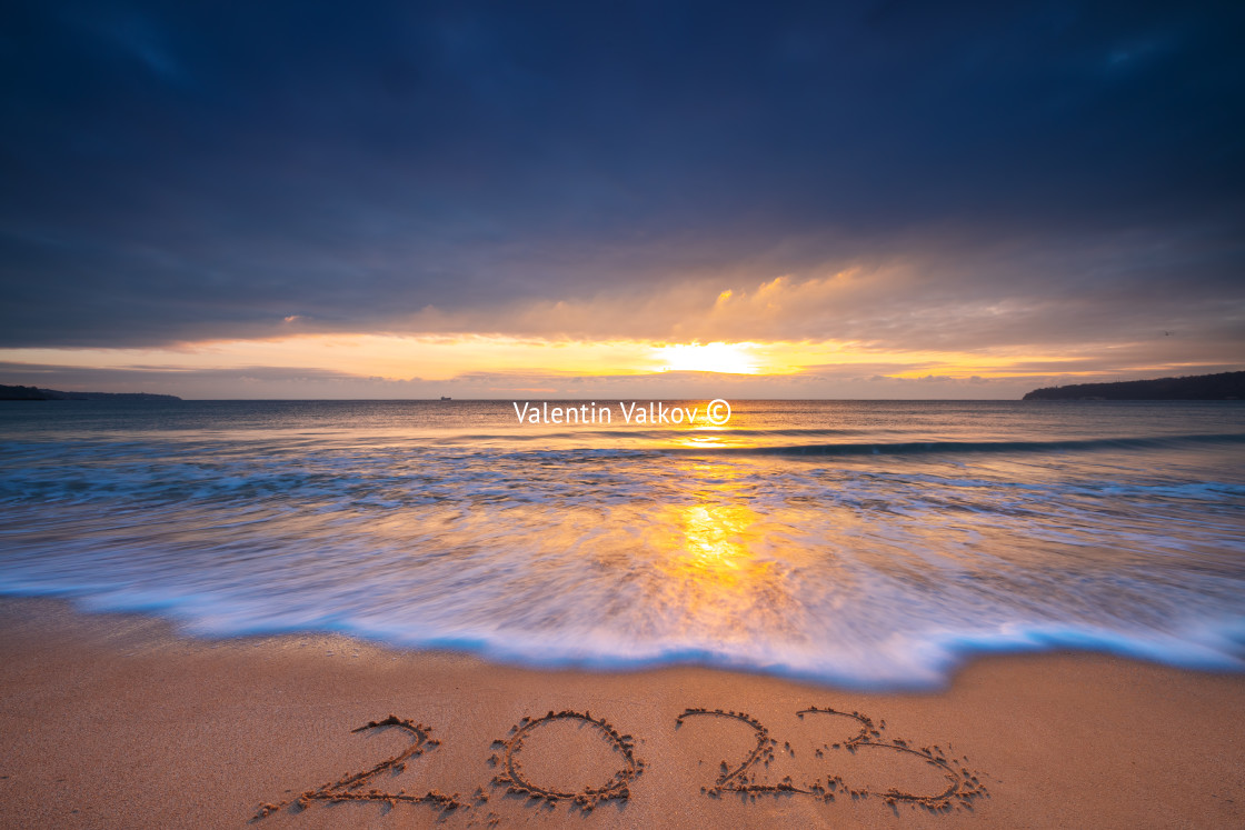 "Happy New Year 2023 concept, lettering on the beach. Written tex" stock image