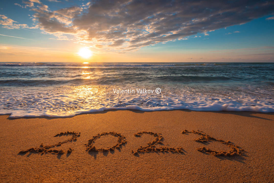 "Happy New Year 2023 concept, lettering on the beach. Written tex" stock image