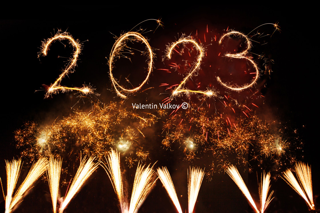 "Happy new year 2023 written with Sparkle firework on black backg" stock image