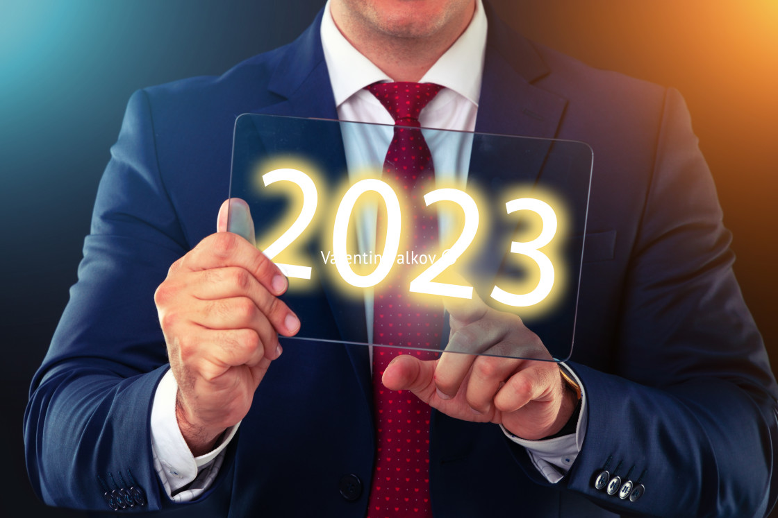 "Businessman working with future technology screen, new year 2023" stock image